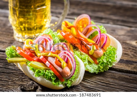 Two fresh homemade hot dog with beer