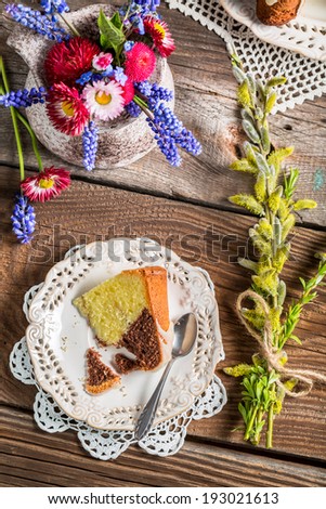 Easter cake, cup of coffee and spring flowers