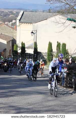 ALLEX, FRANCE - MAR 02: Unidentified professional cyclist riding La Classic Drome UCI Europe Tour Pro Race on March 02, 2014 in Allex Hill, Drome, France. Romain Bardet won the race.