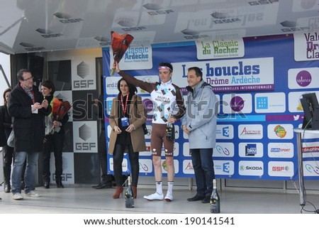 VALENCE, FRANCE - MAR 02: Romain Bardet, winner of La Classic Drome UCI Europe Tour Pro Race receiving flowers in podium on March 02, 2014 in Valence, Drome, France.
