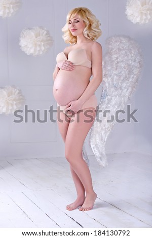 Beautiful angelic pregnant woman. Angel