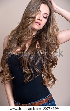 young beautiful woman with long curly hair