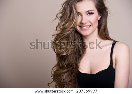 Similar – Image, Stock Photo Pretty brunette, long-haired young woman, teenager, teenager smiles naturally into the camera, in front of a grey wall on vacation. Happy girl with blue eyes, in front of a rock by the sea, on the beach during the summer holidays, looking forward to holidays and summer fun.