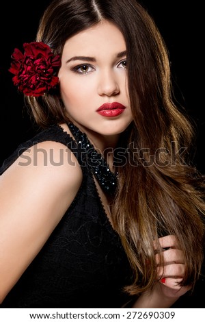 https://image.shutterstock.com/display_pic_with_logo/743137/272690309/stock-photo-young-beautiful-woman-with-stylish-make-up-and-red-flower-in-her-hairstyle-spanish-woman-272690309.jpg