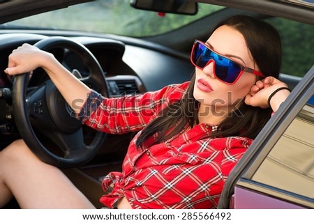Woman in new car. Learner driver student driving car.Driver license exam