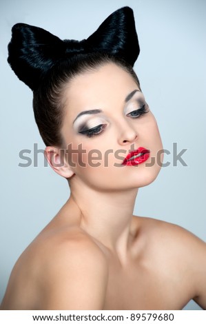Beautiful woman with bow coiffure