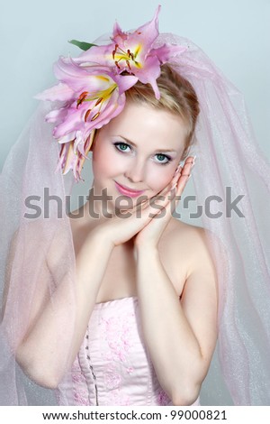 bride with pink lilies in hair