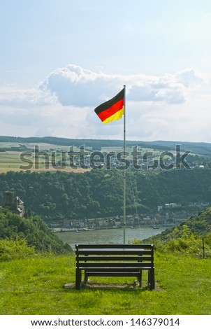 Beautiful summer landscapeand, view on the river Rhein and German flag above the German town of St. Goarshausen in Rhineland-Palatinate