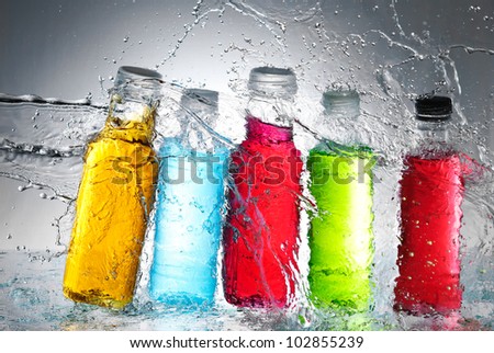 Water splash out of glass - stock photo