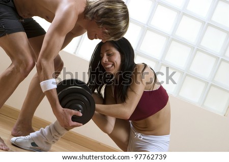 Pair exercising in the gymnasium