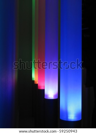 path of lit rainbow lights - black background