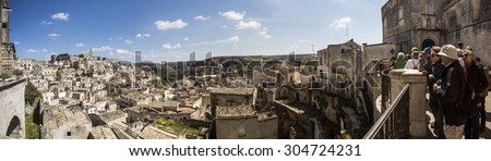 Matera, Italy, April 21, 2015: Tourists visiting stone town April 21, 2015 One of the tourist attractions in Matera; World Heritage in Basilicata, Italy