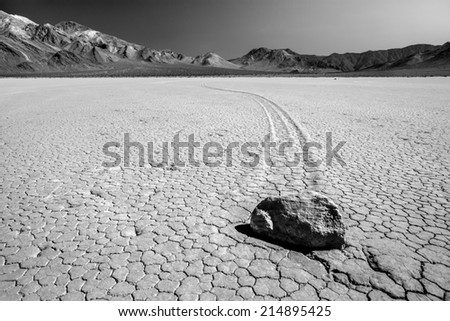 Black and white close up of the elusive moving rocks at Racetrack Playa at Death Valley