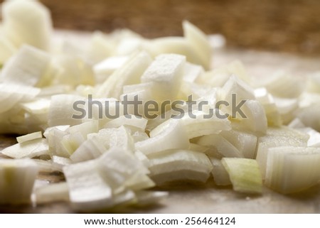 Macro shot of freshly diced onions  - side view