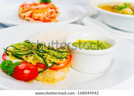 Business lunch on a white background, three dishes