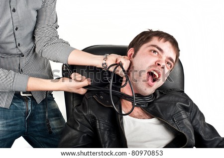 attractive young Europeans in the Caucasus,a black leather jacket,strangled by electric cables leather chair, looks emotionally cord around his neck,a wire around his neck, fork,isolated over white