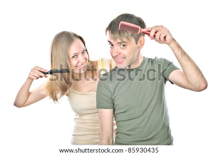 boy and girl are holding a comb, isolated over white