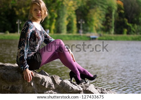girl in purple tights near the river