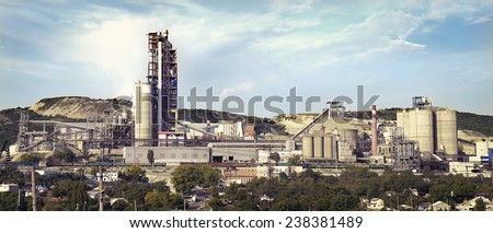 panorama of a cement plant in a sunny summer afternoon