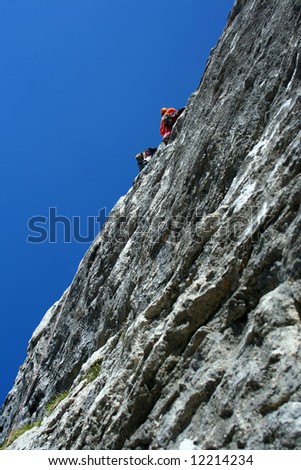 Climber team climbing on rock