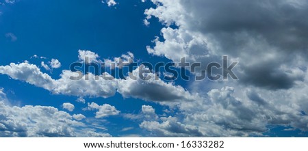 White summer clouds on blue sky scene