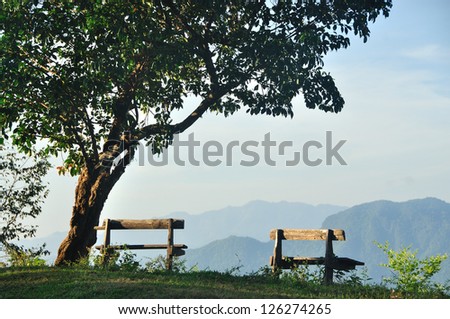 Wood chair and mist landscape, north of Thailand