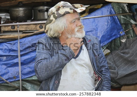 SAO PAULO, BRAZIL - FEBRUARY 08, 2015: An unidentified homeless with his house and things living at the famous Paulista Avenue in Sao Paulo Brazil.