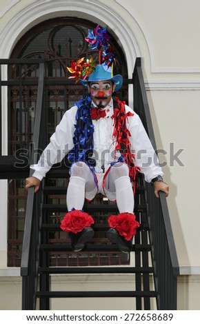 SAO PAULO, BRAZIL - MARCH 8, 2015: An unidentified funny clown with typical costumes on the streets of Sao Paulo Brazil.