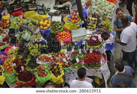 SAO PAULO/BRAZIL - MAY 9: An unidentified man at a fruit stand in Central Market of Sao Paulo on May 09, 2015. This landmark is a destination for tourists and locals.