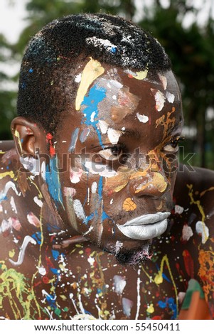 closeup of man with body paint daubed on skin