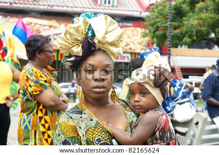PORT OF SPAIN - AUGUST 1: Celebrating Emancipation Day which commemorates the abolition of Slavery August 1, 2011 in Port Of Spain, Trinidad & Tobago.  Colorful & elaborate headpieces are usually worn.