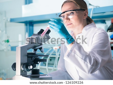 Scientist with a test tube working  at the laboratory
