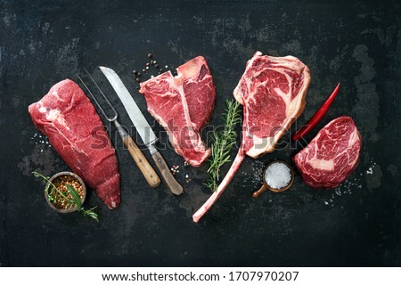 Variety of raw beef meat steaks for grilling