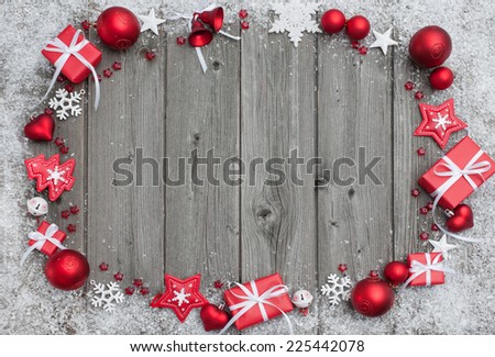 Christmas background with festive decoration over wooden board