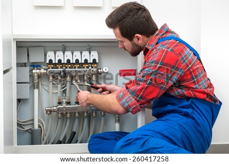 Technician servicing the underfloor heating