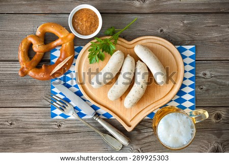 Similar – Image, Stock Photo German white sausage table top view. Bavarian veal sausage section