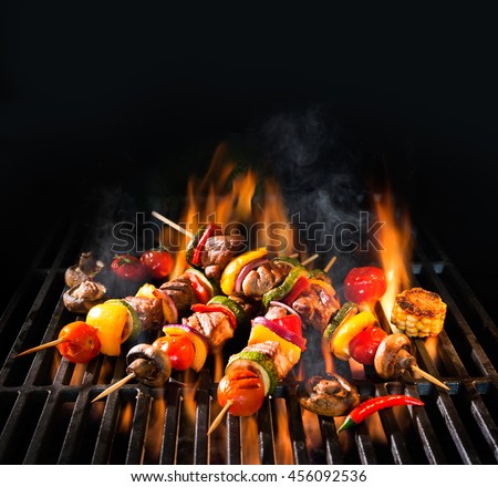 Barbecue skewers meat kebabs with vegetables on flaming grill ストックフォト © 