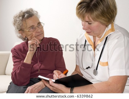 An elderly women by a doctor