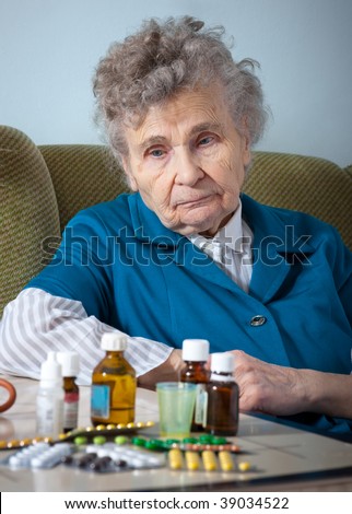 elderly woman with her medicine