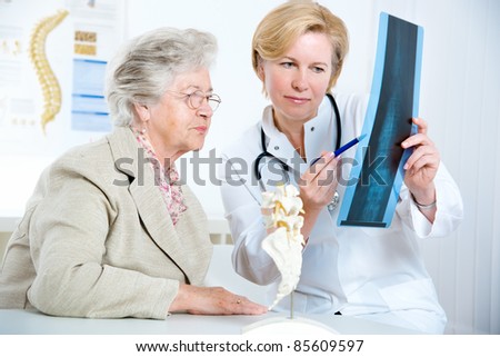 Doctor and patient discussing scan results in diagnostic center