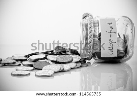 A lot of money in a glass bottle labeled :College fund