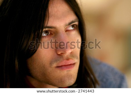 handsome man with long hair vertical