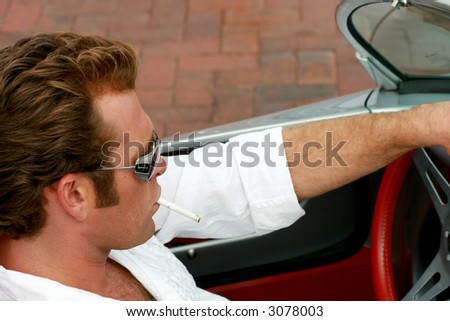 cool dude driving a sports car