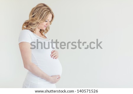 Similar – Image, Stock Photo Pregnant woman caressing her belly