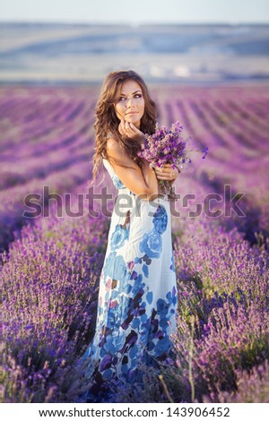 https://image.shutterstock.com/display_pic_with_logo/745759/143906452/stock-photo-beautiful-provence-woman-relaxing-in-lavender-field-watching-on-sunset-holding-basket-with-lavanda-143906452.jpg