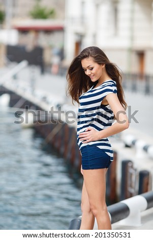 Beautiful woman sailing, young adult lady enjoying summer travel, close-up portrait on sexy female face, summer cruise holidays, European girl tourist traveling in sail boat around the world