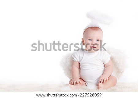 Cute infant angel with wings isolated on white. beautiful little boy dressed as an angel. valentine\'s day. baby boy with angel wings
