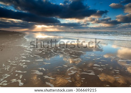 gold sunset on North sea beach, North Holland, Netherlands