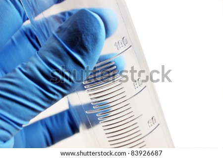graduated cylinder in arm over white
