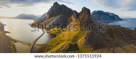 scenic road in Iceland, beautiful nature landscape aerial panorama, mountains and coast at sunset 商業照片 © 